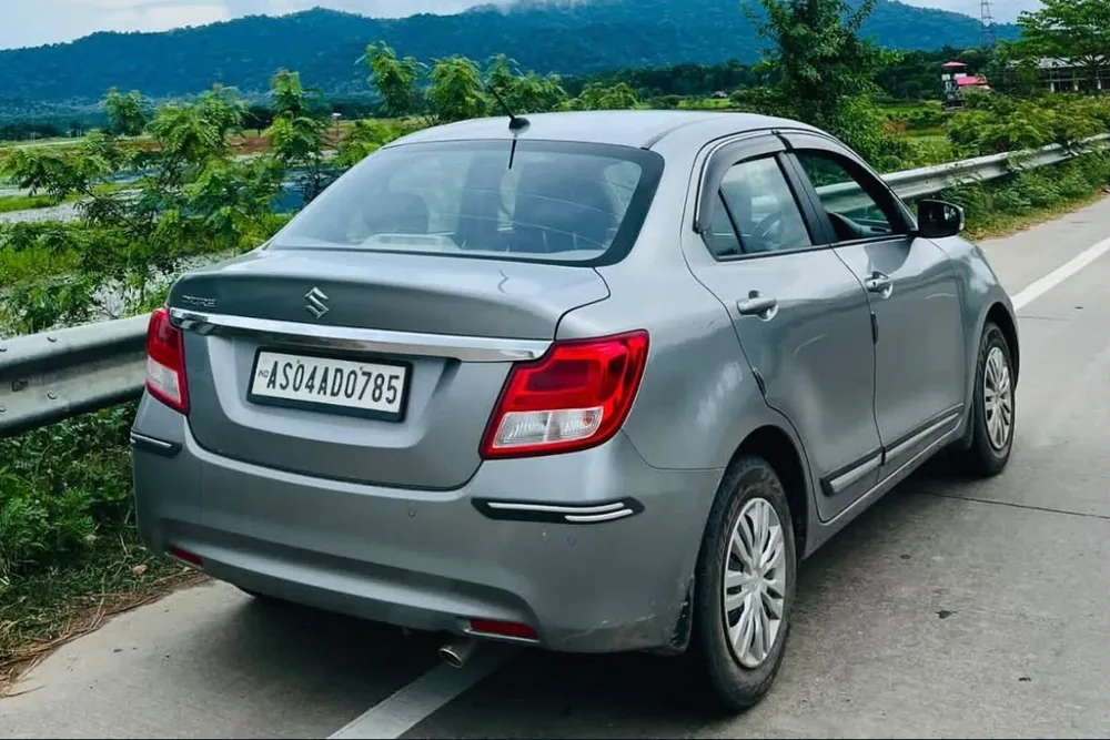 Real MD Cabs Maruti Suzuki Dzire sedan, part of our Jorhat taxi fleet